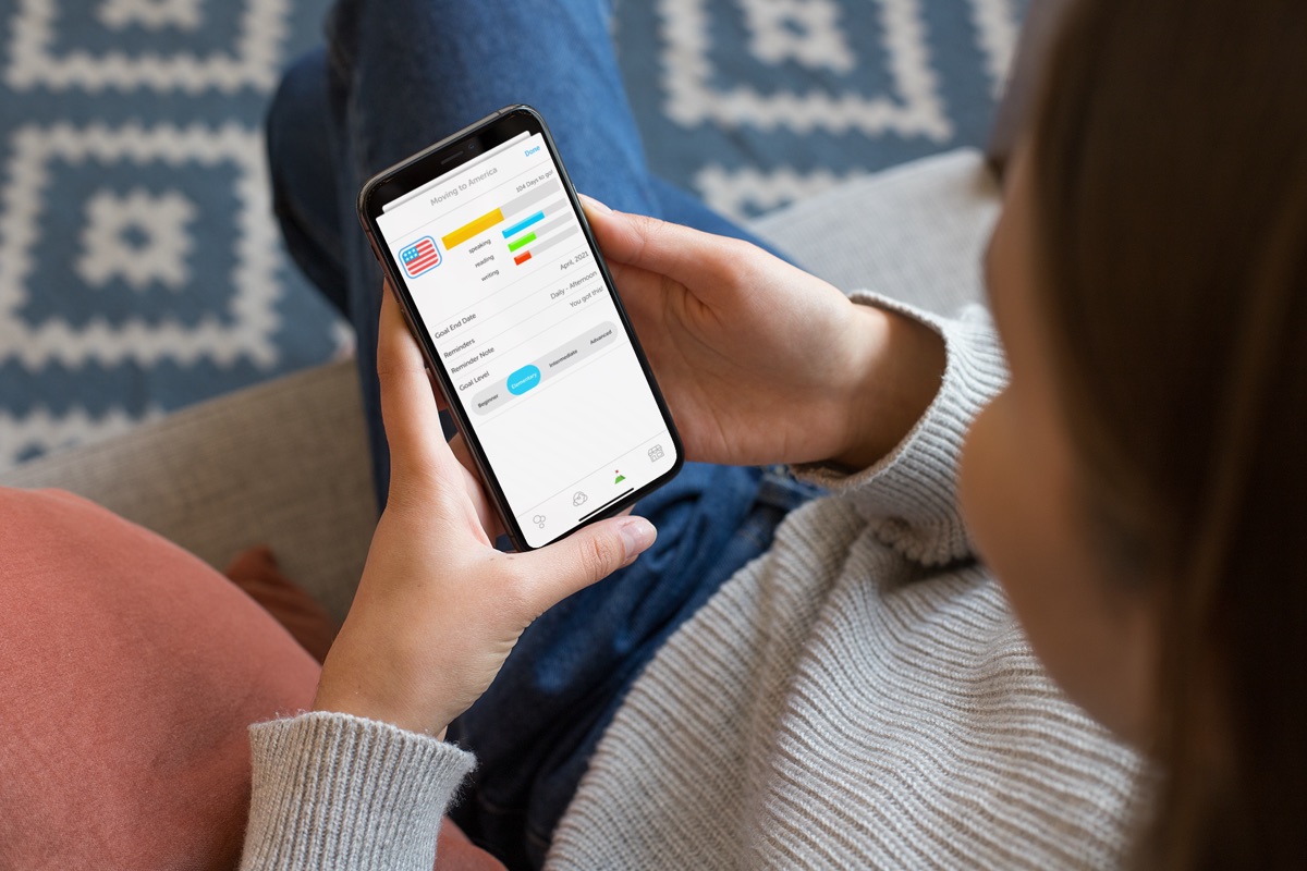 Someone on a couch setting a goal in the DuoVillage app